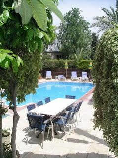Renos Hotel Apts Polis Bagian luar foto